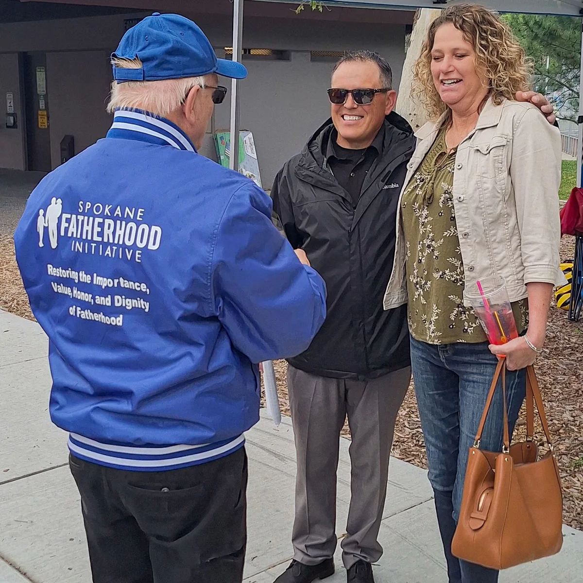 SpoFI President, Ron Hauenstein talking with Don Morrison and his Dept. of Corrections (DOC) Reentry Navigator, Jennifer Pace