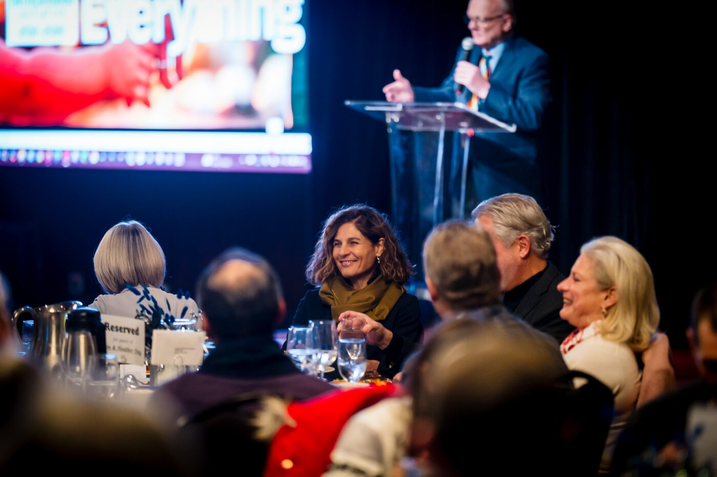 Guests laugh at Ron Hauenstein's opening dad jokes during the Spokane Fatherhood Initiative 10th anniversary celebration at Mirabeau Park Hotel, February 2026