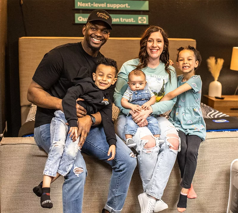 Ike and Rachel Whitaker with their kids at their store, Whitaker Family Furniture on N. Monroe