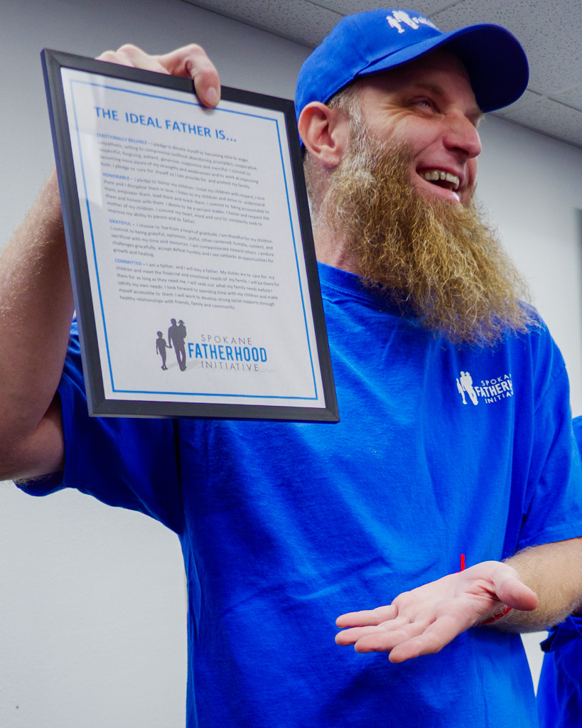 Proud fidelity monitor and Graduate, Jared Nelson, lifts “The Ideal Father Is…” pledge—reminding everyone what this journey is really about.