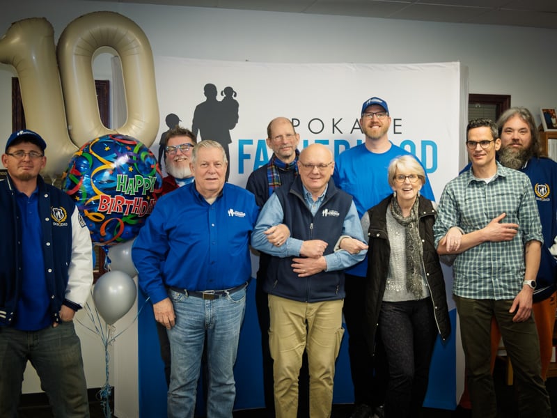 Ten years of changed dads: SpoFI celebrates a decade of transforming fathers and families 5 SpoFI leadership team and staff at 10th anniversary celebration showing organizational growth from founder Ron Hauenstein vision January 2026