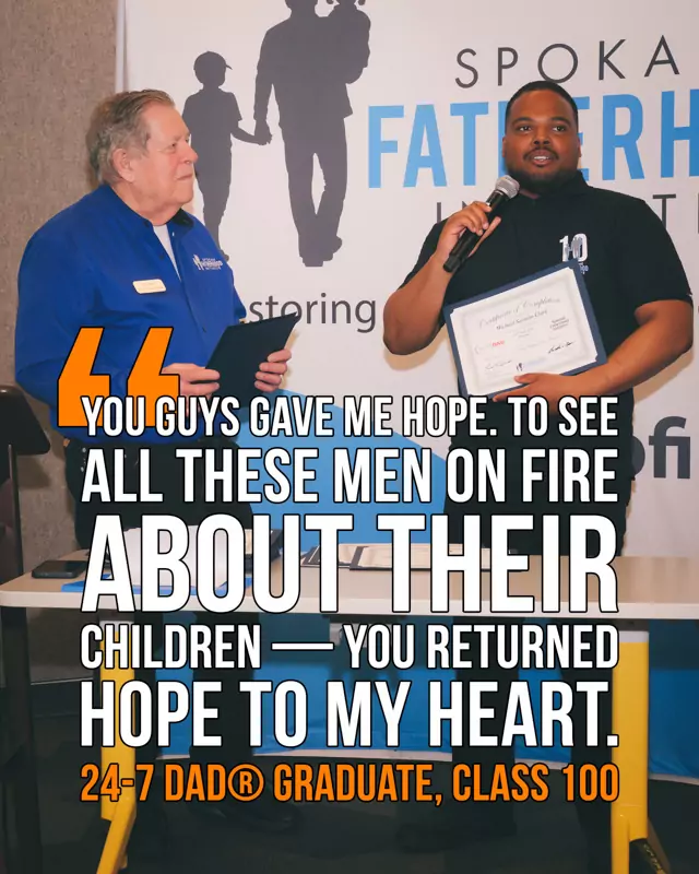 Michael Sarasin Clark accepts his certificate at SpoFI's 100th 24-7 Dad® graduation alongside Ron Hauenstein: "You guys gave me hope. To see all these men on fire about their children — you returned hope to my heart."
