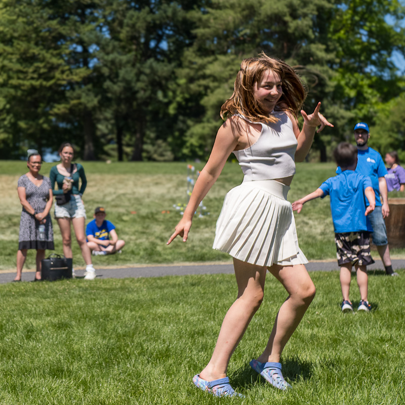 Community connection strengthens Spokane families at Father's Day celebration 7 Young person dances with hair in motion during Father's Day celebration activities at Riverfront Park