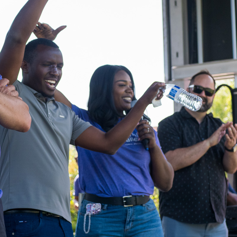 Community connection strengthens Spokane families at Father's Day celebration 16 Kitara Jones-Johnson announces the dad joke contest winner while participants celebrate with raised arms during Father's Day closing activities