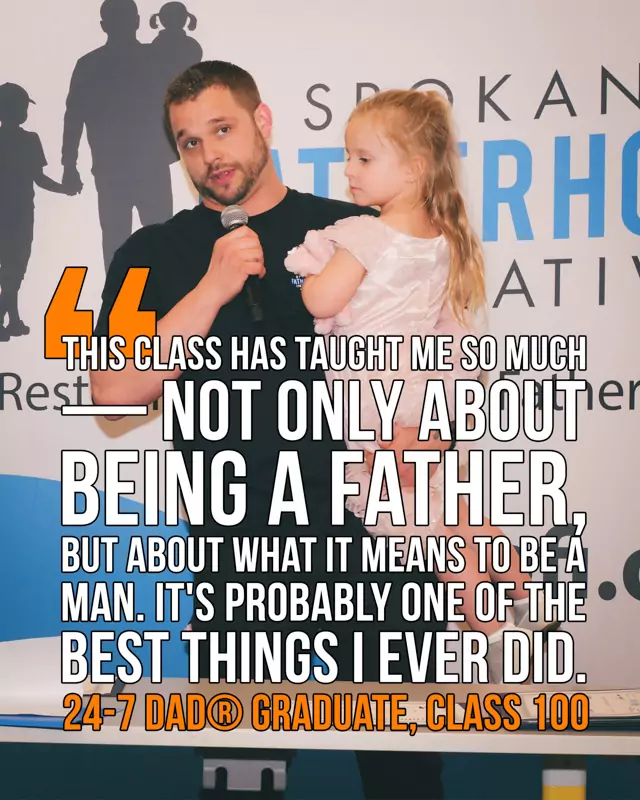 Timothy Booth holds his daughter while speaking at SpoFI's 100th 24-7 Dad® graduation: "This class has taught me so much — not only about being a father, but about what it means to be a man. It's probably one of the best things I ever did."